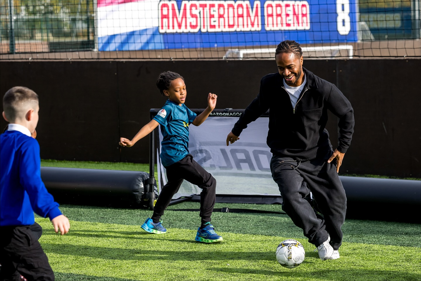 Raheem playing football